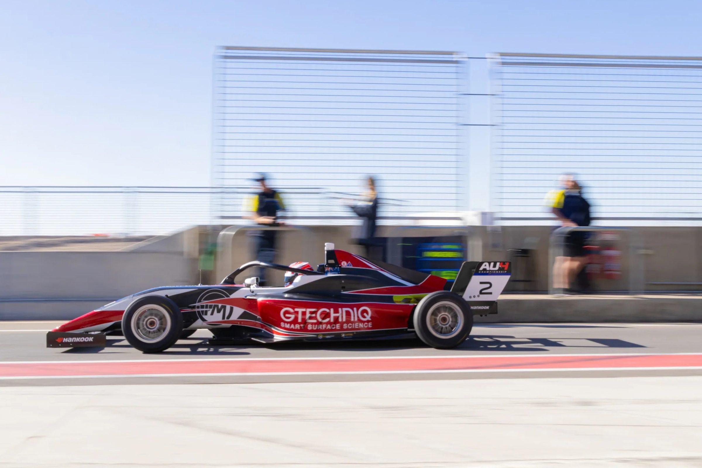 Georgia Morgan driving her number 2 Gtechniq Formula 4 car down pit lane